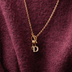 Charm con letra pavé